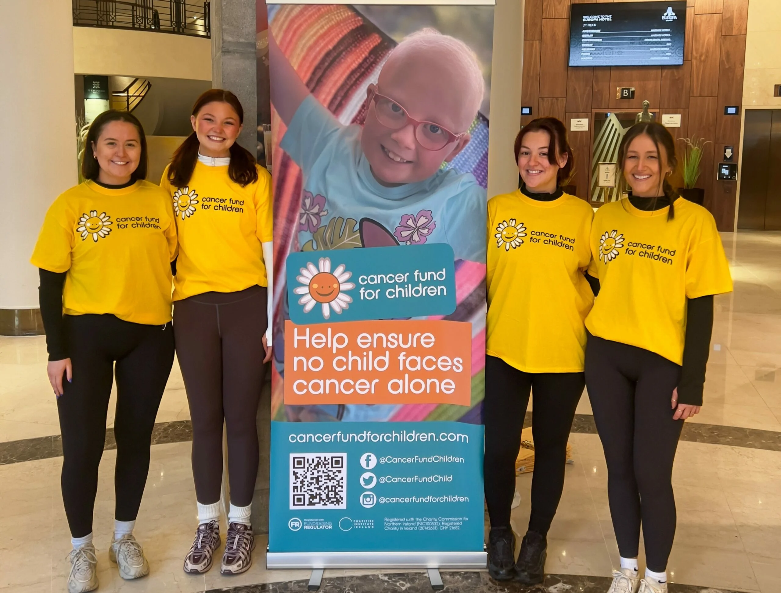 The Morrows Team, pictured left to right, Laura Magennis, Hannah Knox, Olivia Meehan and Ellie Maunsell taking on the abseil challenge at the Europa Hotel for Cancer Fund For Children