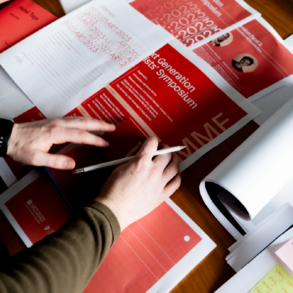 Designer reviewing design print outs