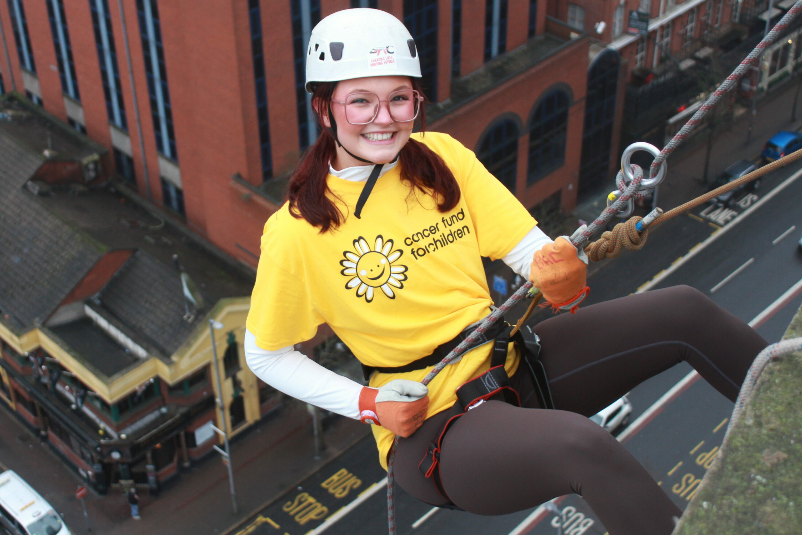 Hannah Abseiling at The Europa to raise funds for Cancer Fund for Children