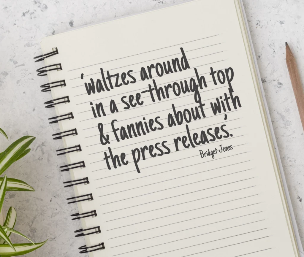 Notebook with the words 'waltzes around in a see-through top & fannies about with the press releases.' Bridget Jones, written on it