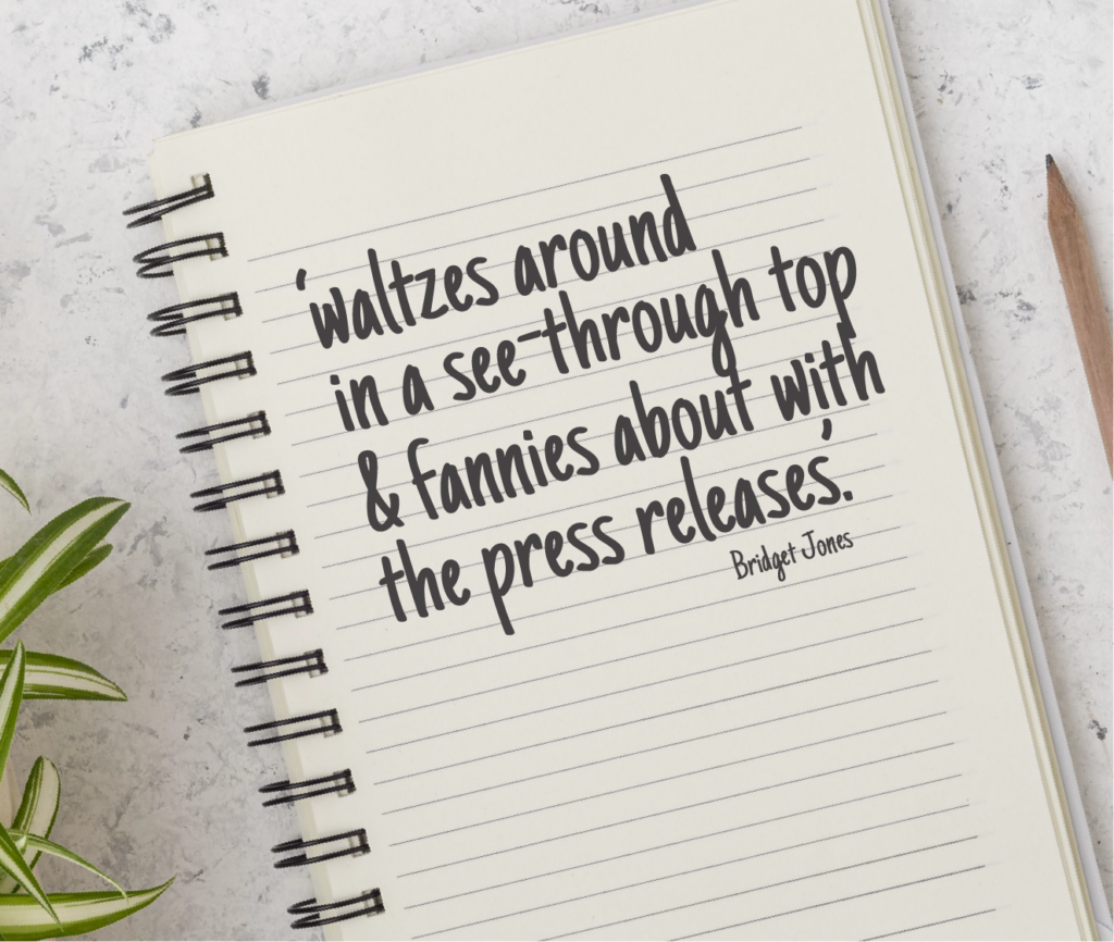 Notebook with the words 'waltzes around in a see-through top & fannies about with the press releases.' Bridget Jones, written on it